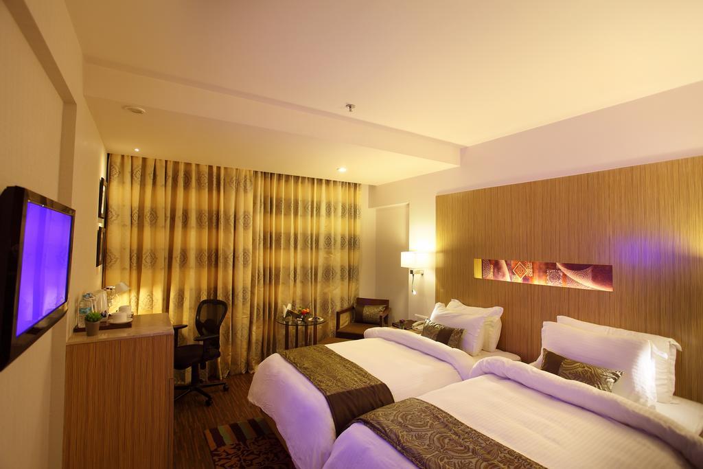 Comfort Inn Legacy Rajkot Zimmer foto